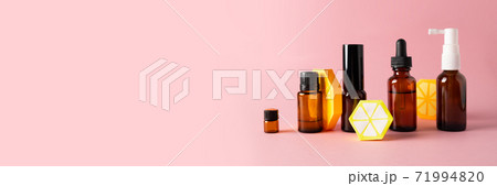 Essential oils, various bottles aromatherapy on a pink background. Aromatherapy and perfumes concept 71994820