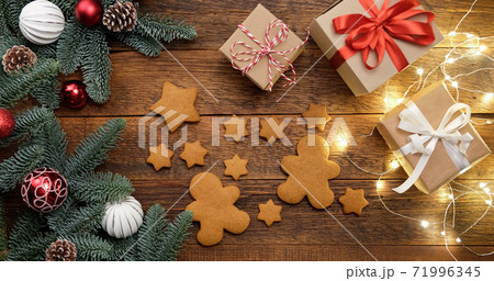 Gingerbread cookies, Christmas gifts and fir tree Gingerbread cookies, Christmas gifts and fir tree 71996345