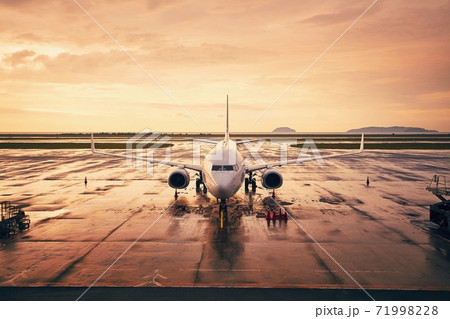 Airplane at airport during golden hour Airplane at airport during golden hour 71998228