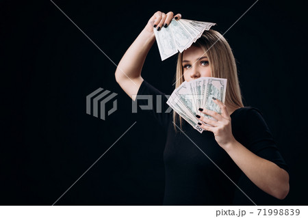 Stunning woman holding money cash 71998839