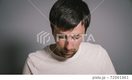 Male have flu, virus or allergy. Healthy medicine and people concept. Sick guy sit on bed and has runny nose. Allergies, runny nose and sneezing. Disease. Cheer at home. Blowing Nose 72001861