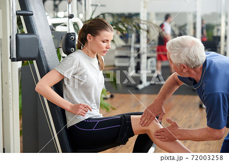 Young fit woman injured leg during workout. 72003258