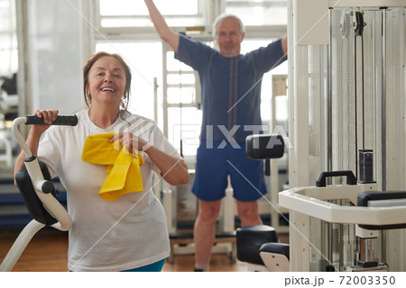 Happy senior woman after hard training at gym. Happy senior woman after hard training at gym. 72003350