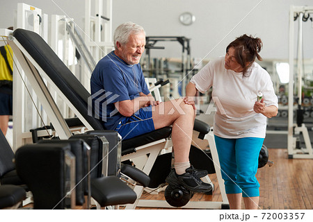 Unhappy senior man with severe pain in knee. Unhappy senior man with severe pain in knee. 72003357