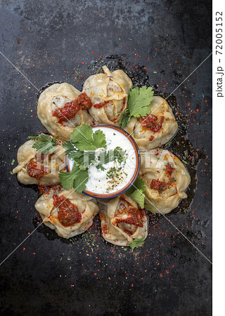 Traditional Uzdek manti steamed with mincemeat with tartar Traditional Uzdek manti steamed with mincemeat with tartar 72005152