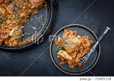 Traditional Louisiana fish jambalaya dish creole cajun with rice and tomatoes 72005158