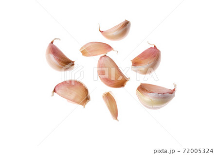Cloves of garlic isolated on white background Cloves of garlic isolated on white background 72005324