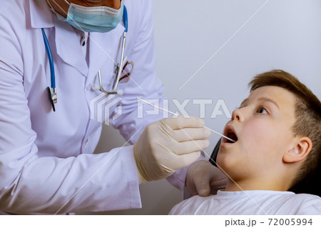 Medical worker to check in teenager on mouth swab for PLR test coronavirus for Covid-19 72005994