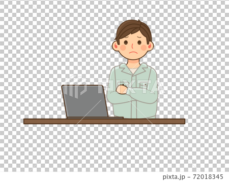 A man in work clothes who is worried with his arms crossed in front of a computer A man in work clothes who is worried with his arms crossed in front of a computer 72018345