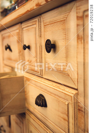 Antique, wooden chest of drawers in a restaurant 72019238