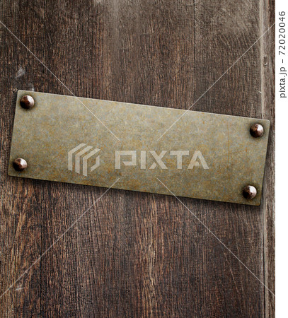 Grunge background with metallic plate on wood board 72020046
