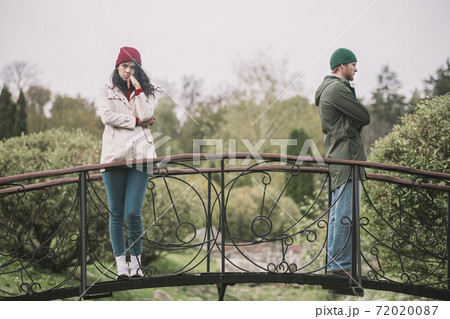 Couple standing separately after having an argument bad vibes. 72020087