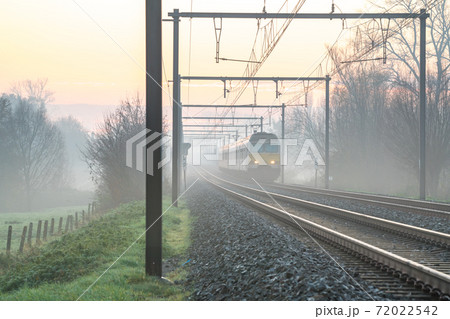 Sunrise to the track whit an train Sunrise to the track whit an train 72022542