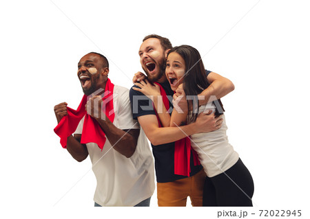 Multiethnic soccer fans cheering for favourite sport team with bright emotions isolated on white studio background Multiethnic soccer fans cheering for favourite sport team with bright emotions isolated on white studio background 72022945