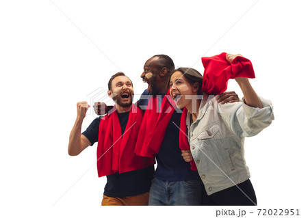 Multiethnic soccer fans cheering for favourite sport team with bright emotions isolated on white studio background Multiethnic soccer fans cheering for favourite sport team with bright emotions isolated on white studio background 72022951