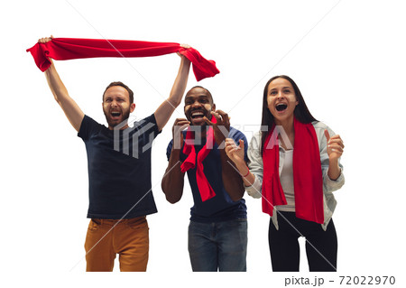 Multiethnic soccer fans cheering for favourite sport team with bright emotions isolated on white studio background Multiethnic soccer fans cheering for favourite sport team with bright emotions isolated on white studio background 72022970