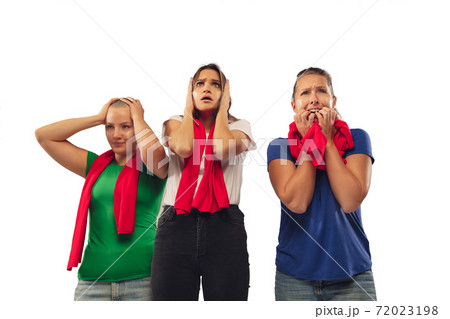 Female soccer fans cheering for favourite sport team with bright emotions isolated on white studio background 72023198