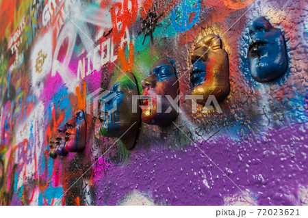 Graffiti on the wall of John Lennon in Prague - Czech Republic 72023621