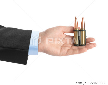 Hand with bullets Hand with bullets 72023629