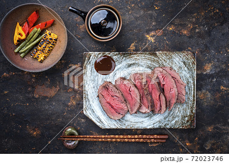 Traditional Japanese barbecue wagyu dry aged fillet beef steak with vegetable slices  72023746