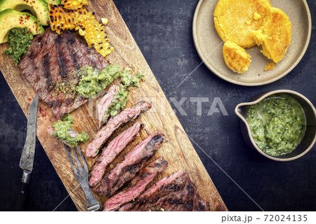Barbecue dry aged wagyu flank steak with corn, avocado and chimichurri sauce Barbecue dry aged wagyu flank steak with corn, avocado and chimichurri sauce 72024135