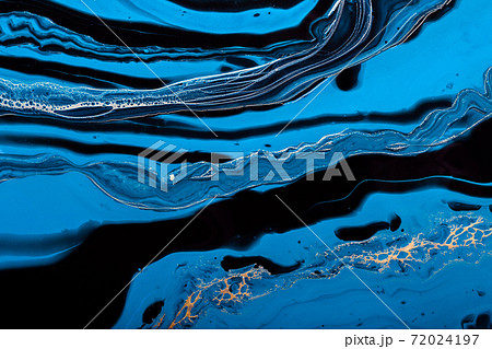 Fluid Art. Golden wave in abstract ocean of blue paint. Marble effect background or texture 72024197
