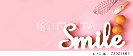 Ingredients for cooking baking - egg, sugar, rolling pin on pink background. Concept of cooking dessert. banner 72025367