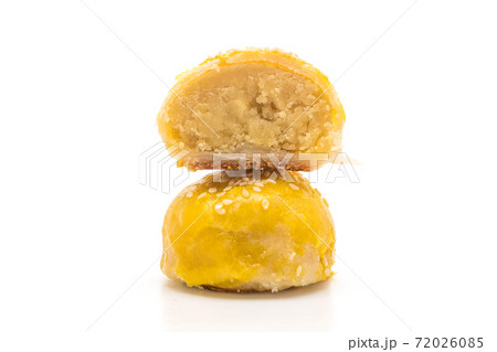 Chinese pastry or moon cake filled with mung bean paste and salted egg yolk Chinese pastry or moon cake filled with mung bean paste and salted egg yolk 72026085