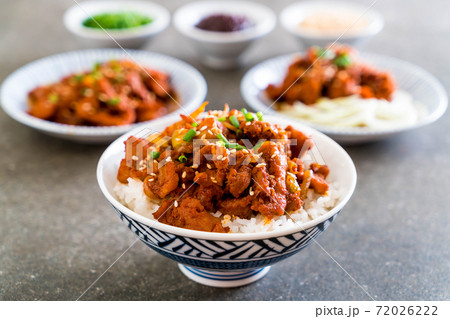fried pork with spicy korean sauce (bulgogi) on top rice fried pork with spicy korean sauce (bulgogi) on top rice 72026222