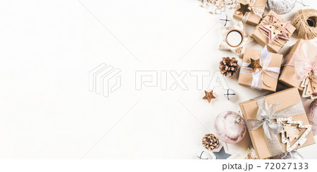 Festive Christmas background with gift boxes and Christmas decorations 72027133