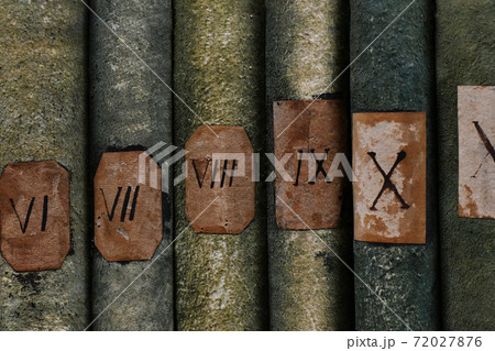 Old books with Roman numerals in the library Old books with Roman numerals in the library 72027876