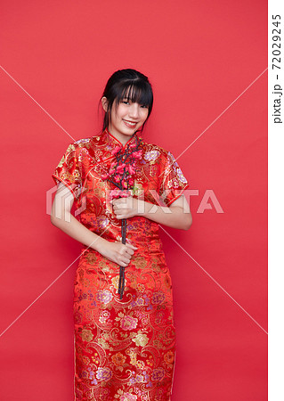 Asian women in red traditional Chinese dress Asian women in red traditional Chinese dress 72029245