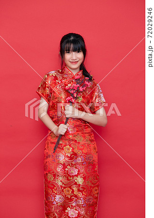 Asian women in red traditional Chinese dress Asian women in red traditional Chinese dress 72029246