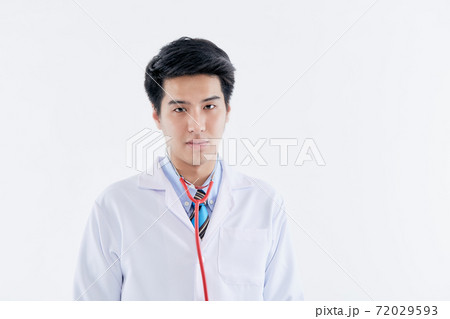 young man doctor posing with a stethoscope young man doctor posing with a stethoscope 72029593