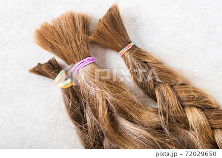 Cut long hair as donation for cancer charity Cut long hair as donation for cancer charity 72029650