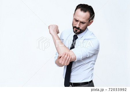 A man stands on a white background.  72033992