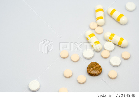 Pill and drug capsule and tablets on white background Pill and drug capsule and tablets on white background 72034849