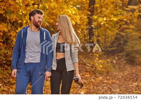 happy lovely couple enjoying walk in the forest, have talk happy lovely couple enjoying walk in the forest, have talk 72036554