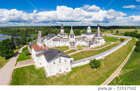 Aerial Panaramic view to Ferapontov Belozersky male monastery of XV century. Complex of temples Located on the shore of the Borodaevsky Lake. Russian Orthodox Church. Kirillov. Vologda Region. Russia Aerial Panaramic view to Ferapontov Belozersky male monastery of XV century. Complex of temples Located on the shore of the Borodaevsky Lake. Russian Orthodox Church. Kirillov. Vologda Region. Russia 72037502