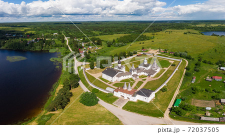 Aerial Panaramic view to Ferapontov Belozersky male monastery of XV century. Complex of temples Located on the shore of the Borodaevsky Lake. Russian Orthodox Church. Kirillov. Vologda Region. Russia Aerial Panaramic view to Ferapontov Belozersky male monastery of XV century. Complex of temples Located on the shore of the Borodaevsky Lake. Russian Orthodox Church. Kirillov. Vologda Region. Russia 72037505