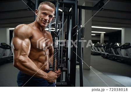 Caucasian man pumping up muscles. fitness training Caucasian man pumping up muscles. fitness training 72038018