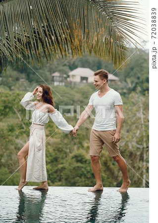 Couple standing on a forest backgroung on a Bali Couple standing on a forest backgroung on a Bali 72038839