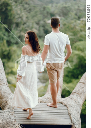 Couple standing on a forest backgroung on a Bali 72038841