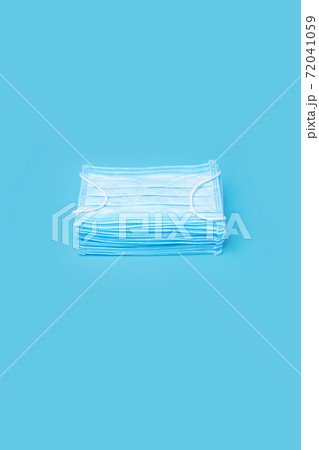 Healthcare Background with Mask. Coronavirus Prevention Medical Surgical Masks. Stack Mask. Pile Mask. Many Blue Medical Face Masks. Protection Covid-19. Typical 3-ply Disposable Mask Stacked Pile 72041059