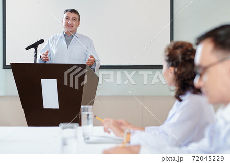 Physician speaking at conference 72045229