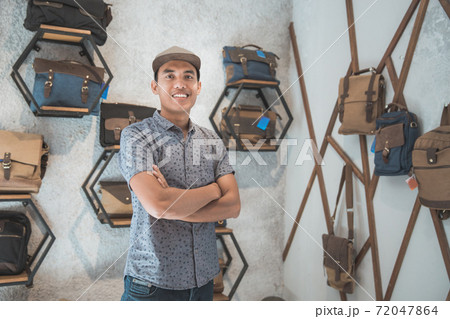 asian male business owner in a bag shop 72047864