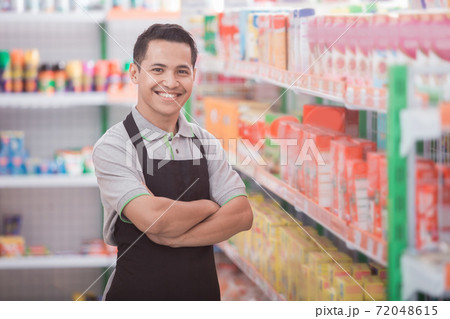 male staff working at super market 72048615