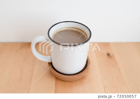 White hot coffee cup on wooden table with copy space. White hot coffee cup on wooden table with copy space. 72050057