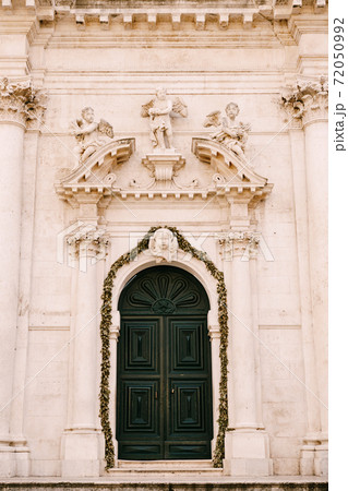 Sculptures of Angels above the entrance of Saint Blaise Church In Dubrovnik, Croatia Sculptures of Angels above the entrance of Saint Blaise Church In Dubrovnik, Croatia 72050992