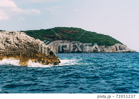 A cave in a rock on the Lustica Peninsula, in Montenegro. 72051237